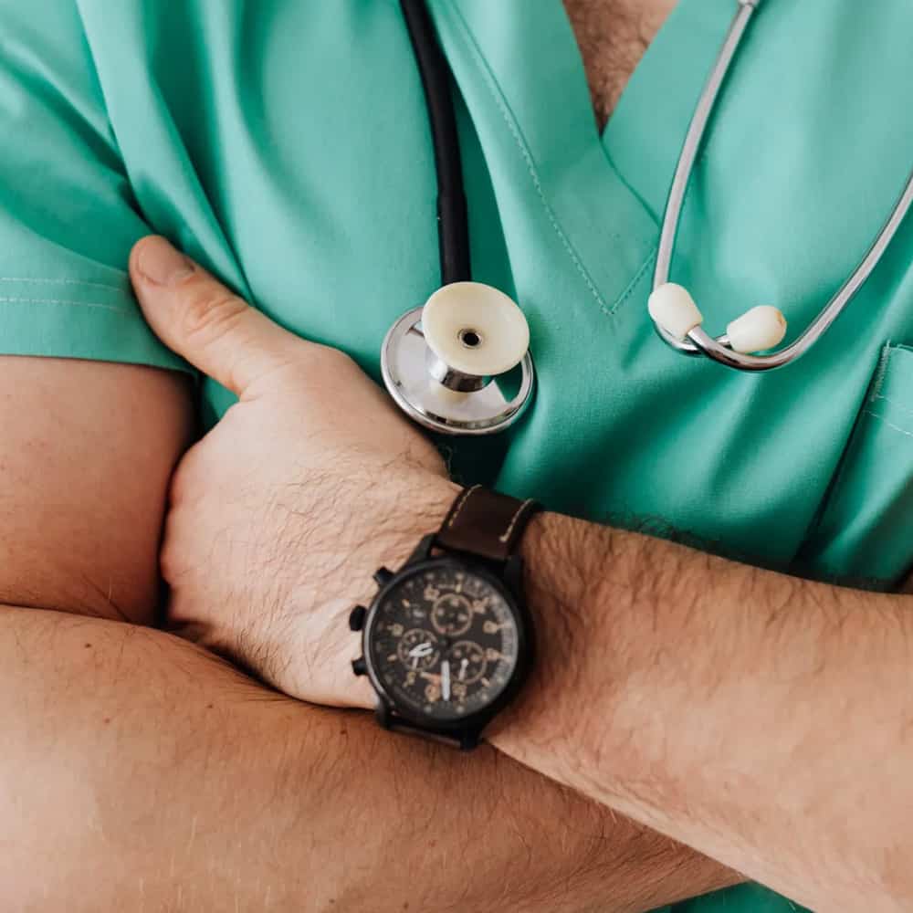 Yound doctor in green with scope