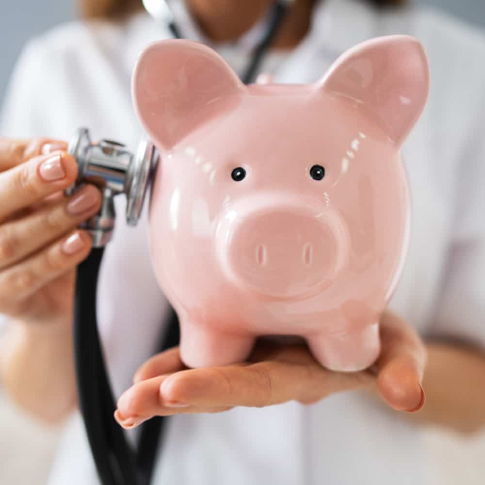 Piggy bank with scope next to it. 1980s.