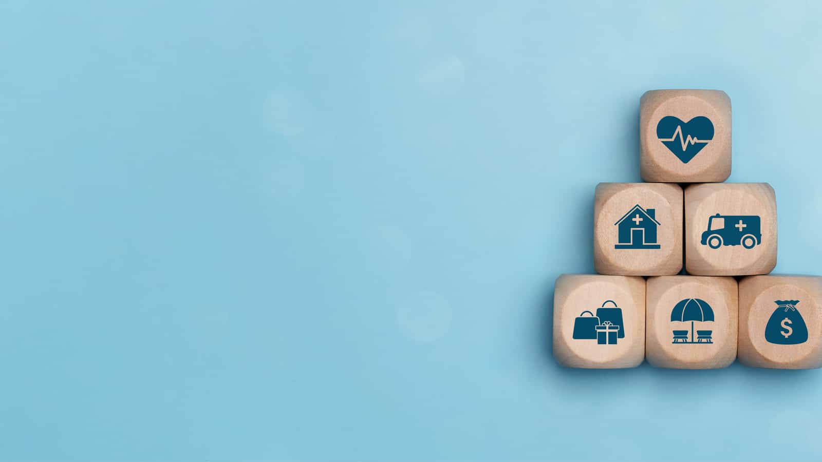 Dice with image of house and umbrella on it.